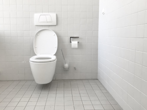 A bathroom with white tiles